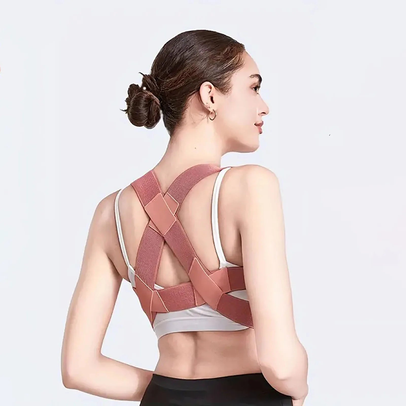 Adjustable back posture corrector brace supporting upper spine and back alignment, designed for improved posture and comfort.