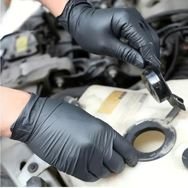 Black nitrile disposable gloves for work, cleaning, tattooing, and beauty, textured, latex-free, in packs of 10, 20, 50, or 100 pieces.