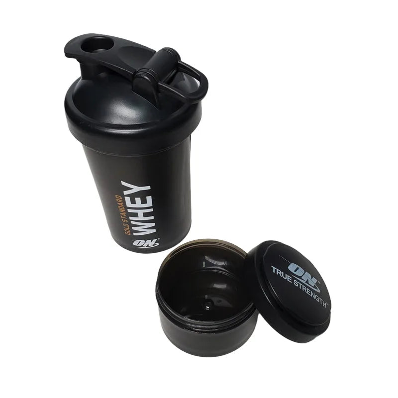 Large 450ML plastic shake cup with ball mixer, suitable for protein powder, featuring a medicine box compartment for fitness use.