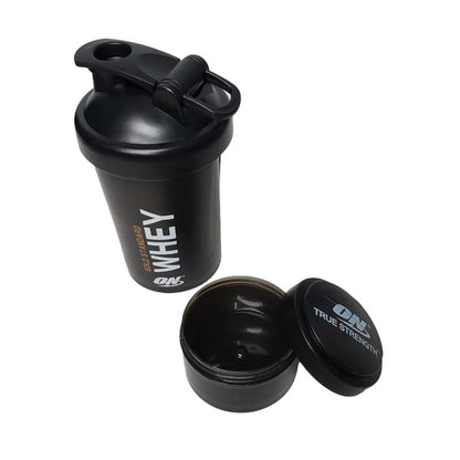 Large 450ML plastic shake cup with ball mixer, suitable for protein powder, featuring a medicine box compartment for fitness use.