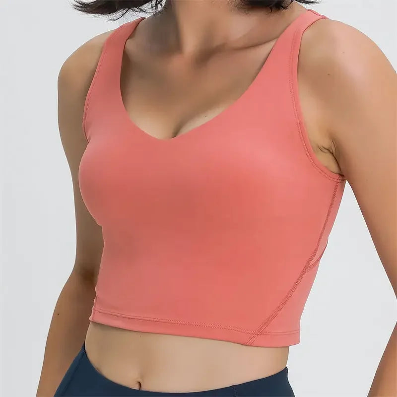 Nepoagym PASSION tank top with built-in shelf bra and removable padding, longline crop top ideal for yoga and gym workouts.