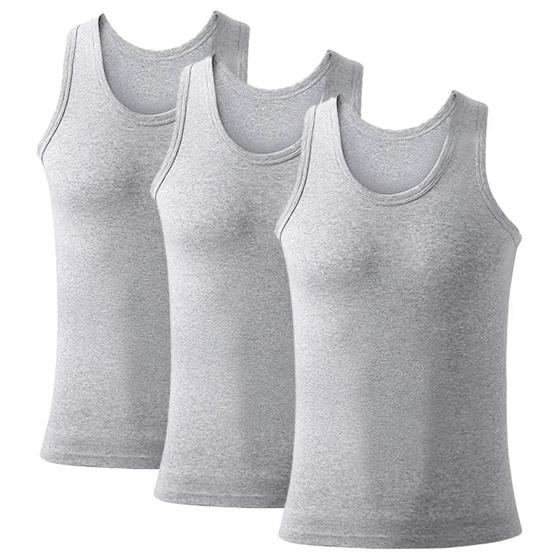 Three men's cotton tank tops in solid colors, breathable and sleeveless, perfect for summer exercise and fitness wear.
